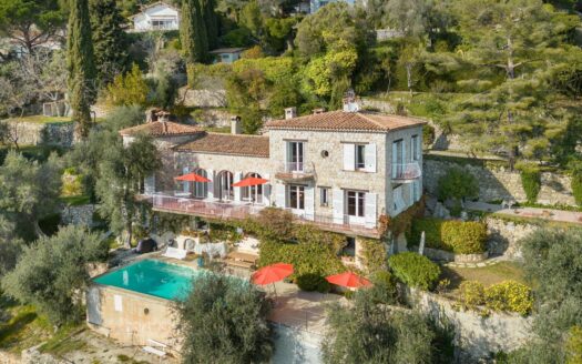 Stone farmhouse overlooking the sea and the village