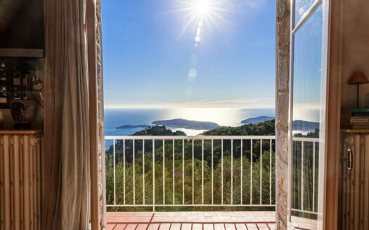 Stone farmhouse overlooking the sea and the village