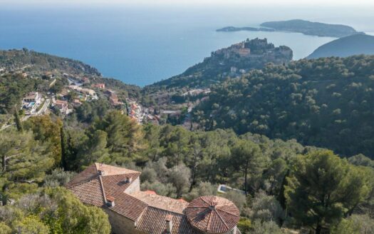 Stone farmhouse overlooking the sea and the village